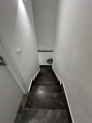 a stairway with a plant in the middle of it at Home Mia in Palermo