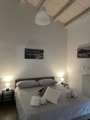a bedroom with a bed with towels on it at L'Oasi del Tirreno in Lascari