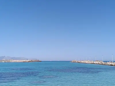 a long pier in the middle of the water at Casa Atlanna in Terrasini