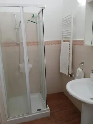 a bathroom with a shower and a sink at Casa Atlanna in Terrasini