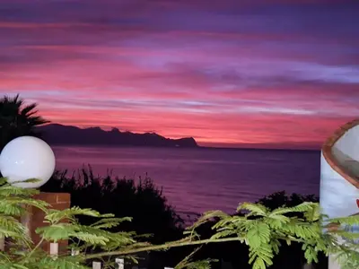 a painting of a sunset over the ocean at Sizilien 3 in Trappeto