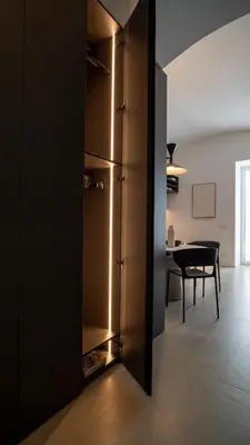 a kitchen and dining room with a table and a refrigerator at Trinacria Marina Apartment in Palermo