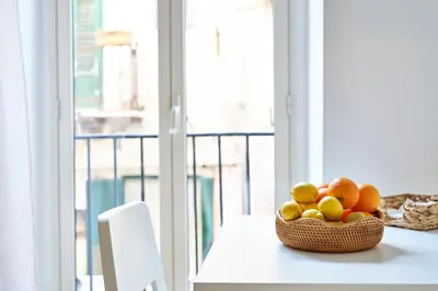 a basket of fruit sitting on a table next to a window at Cara Palermo in Palermo