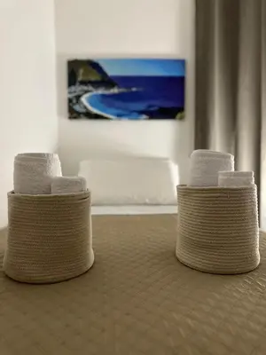 two stacks of towels sitting on top of a floor at Domus Mea Apartments in Carini