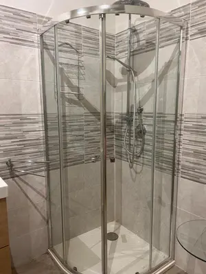 a shower with a glass enclosure in a bathroom at Emanuela Home in Palermo