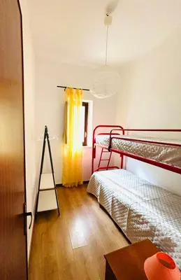 a room with two bunk beds and a ladder at Villetta Verde Mare - Scopello in Scopello