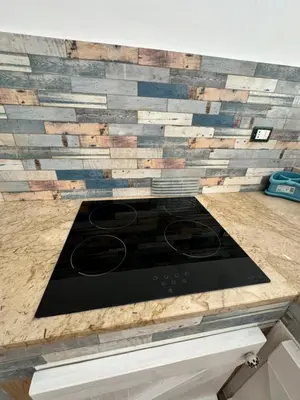 a kitchen counter with a stove top on top at Sicilia biedda casa vacanze in Terrasini