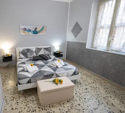 a bedroom with a bed with flowers on it at Gioiello di casa in Palermo