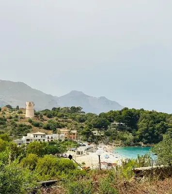 a view of a beach with a body of water at Terrazza Vitaloca in Scopello