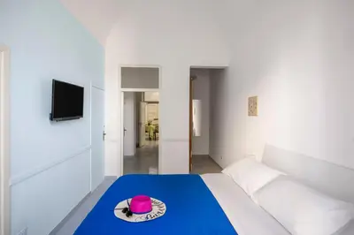 a room with a bed with a hat on it at La Castellana Apartments, vista panoramica sul mare, nel cuore storico di Carini, a due passi dal Duomo e dal castello in Carini