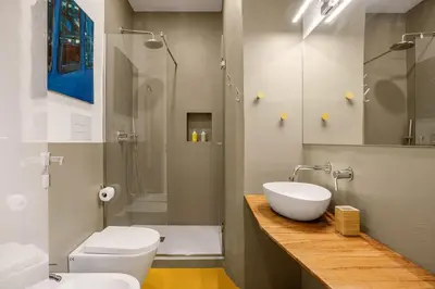 a bathroom with a sink and a toilet and a shower at Azizò in Palermo