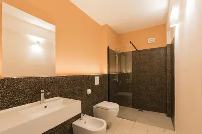 a bathroom with a toilet and a sink and a shower at Visitsicilia Vasile 9 in Castellammare del Golfo
