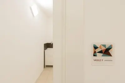 a door in a hallway with a sign on it at Visitsicilia Vasile 9 in Castellammare del Golfo