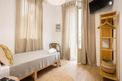 a small bedroom with a bed and a window at Casa Marinù in Palermo