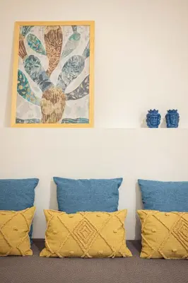 a wall with pillows and a painting on it at Casa Marinù in Palermo