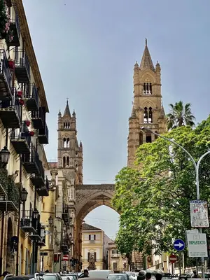 an archway in a city with two towers at Ginevra House in Palermo