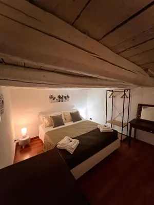 a bedroom with a large bed in a room at Sisidda Home in Palermo