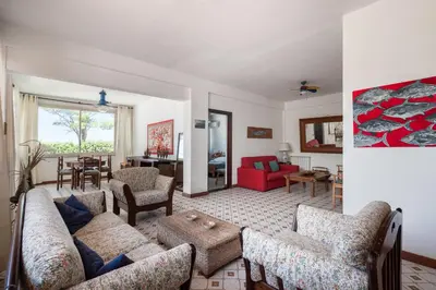 a living room with a couch and a table at Le Casette all'Addaura by Domus Sicily in Mondello