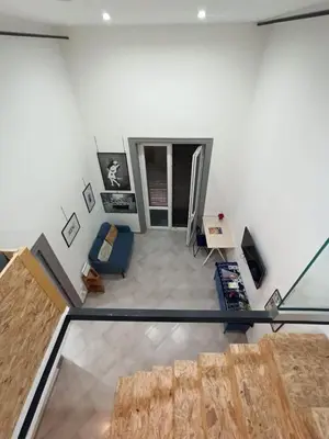 an overhead view of a living room with a table at Glocal flat Maqueda in Palermo