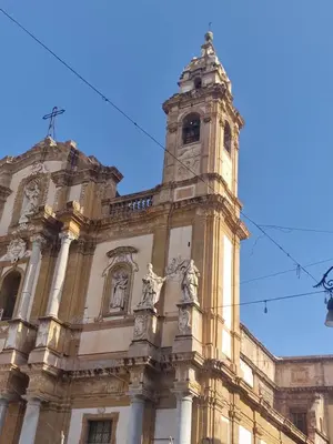a building with a clock tower on top of it at Vista San Domenico in Palermo