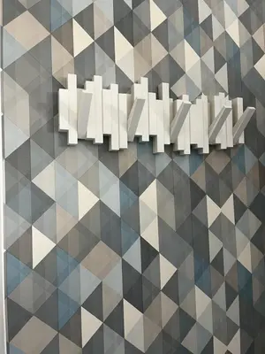 a rendering of the word hk on a geometric pattern at Azzurra in Terrasini