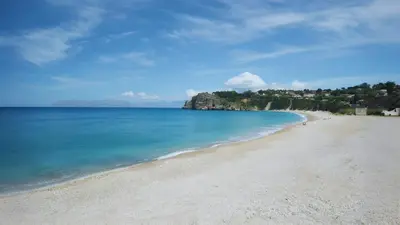 a view of a sandy beach with the ocean at Casa delle Stelle in Scopello