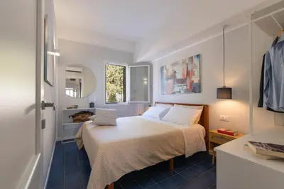 a small bedroom with a bed and a window at Villa Makar Seaview in Macari