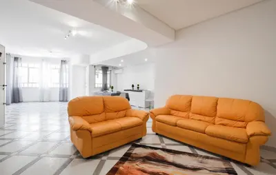 two orange chairs sitting in a living room at Lovely Apartment In Casteldaccia in Casteldaccia