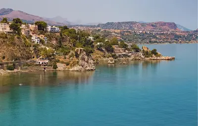 a view of a large body of water with houses at Lovely Apartment In Casteldaccia in Casteldaccia