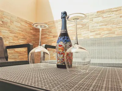 two wine glasses sitting on top of a table at Casa Vacanze Imera House in Palermo