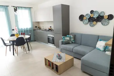 a living room with a couch and a table at Bagheria Home in Bagheria