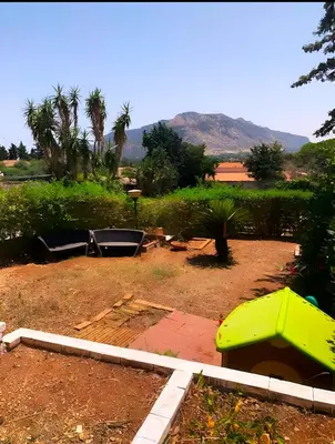 a backyard with a picnic table and a pool at Casa Giulù- in Palermo