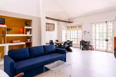 a living room with a blue couch and a table at Casa Giulù- in Palermo