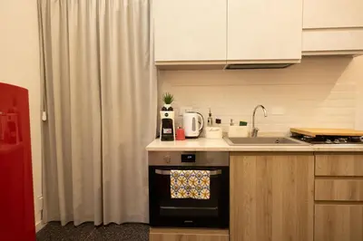 a kitchen with a sink and a counter top at Il Sipario Luxury Apartments in Palermo