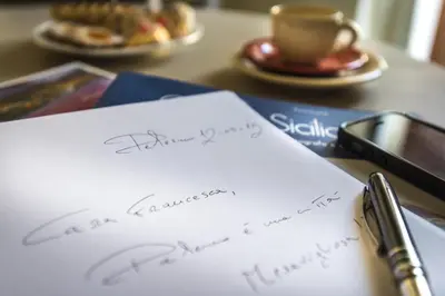 a piece of paper with a thank you note and a cup of coffee at Pane Amore e Marmellata in Palermo