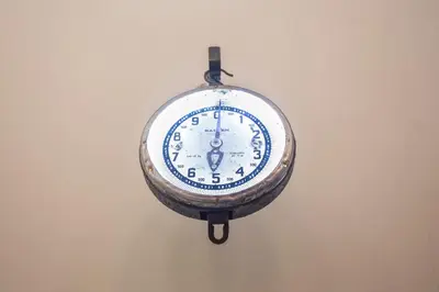 a clock is hanging on a wall at AQUAROOMS Suites in Palermo