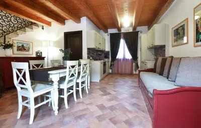 a living room with a table and chairs and a couch at Cozy Home In Partinico With Wifi in Partinico