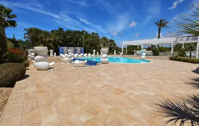 a patio with a pool and chairs and a pavilion at Cozy Home In Partinico With Wifi in Partinico