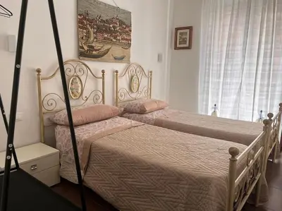 two beds sitting next to each other in a bedroom at Home Sweet Home in Palermo