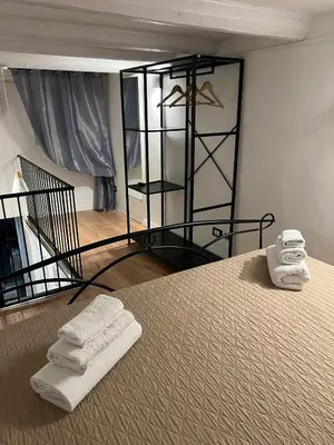 a room with a bed with two towels on it at Sweet home Palermo in Palermo