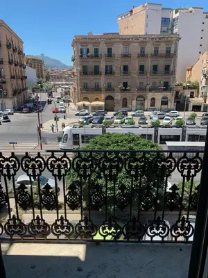 a balcony with a view of a parking lot at Central Station in Palermo