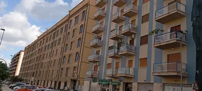 a bedroom with a bed with two towels on it at Apartament di Nick Central Station No ZTL in Palermo