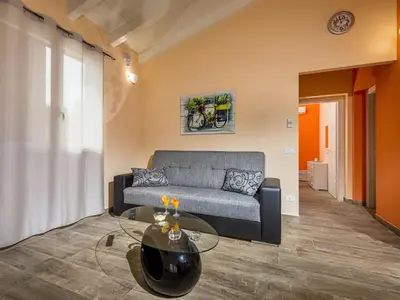 a living room with a couch and a glass table at Villa Mari e Monti by Interhome in Castellammare del Golfo