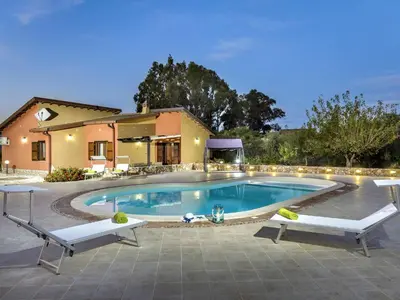 a swimming pool in front of a house at Villa Flavia by Interhome in Castellammare del Golfo