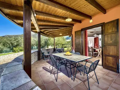 an outdoor dining area with a table and chairs on a patio at Villa Flavia by Interhome in Castellammare del Golfo