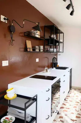 a kitchen with a white counter and a sink at Casa Donna Pippina in Villafrati