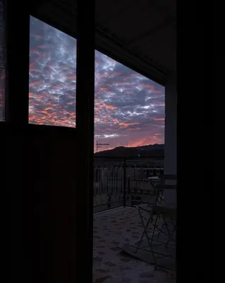 a view of a sunset through a window at Casa Donna Pippina in Villafrati