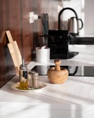 a counter top with a plate with a bottle of oil at Casa Donna Pippina in Villafrati