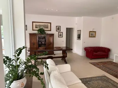 a living room with a couch and a table at Villa Lucia in Palermo