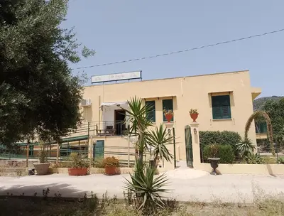 a building with plants in front of it at Villa Buscemi in Bagheria